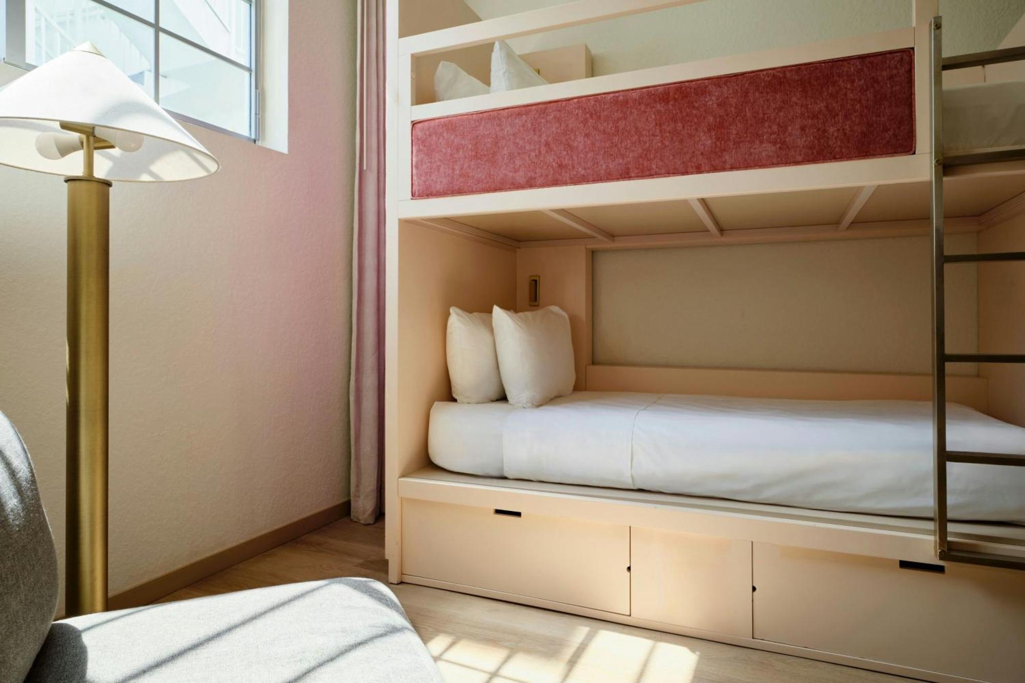 Triple Bunk Room with Three Twin Bunk Beds and Pool View