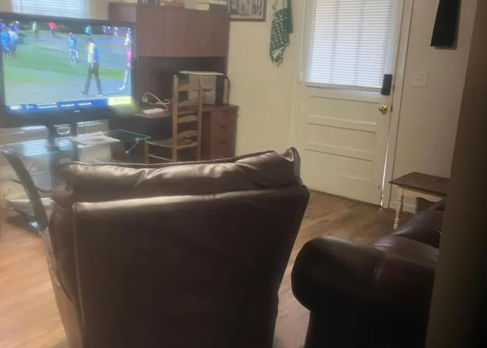 The Clubhouse Masters Golf Themed 1 King Bed 1 Bath Furnished Apartment Full Size Kitchen Full Size Leather Pull Out Sleeper Sofa In Living Room & Full Size Leather Sofa 1 Gig Fiber Internet Directv Premium Package All Sports & Movie Channels & Dvr