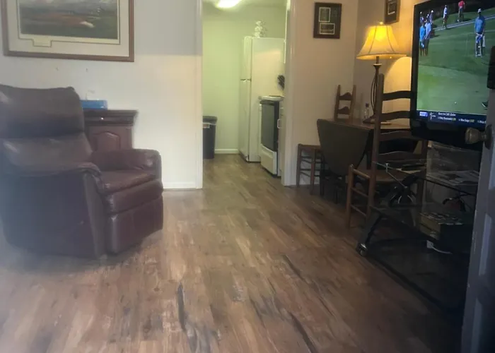 The Clubhouse Masters Golf Themed 1 King Bed 1 Bath Furnished Apartment Full Size Kitchen Full Size Leather Pull Out Sleeper Sofa In Living Room & Full Size Leather Sofa 1 Gig Fiber Internet Directv Premium Package All Sports & Movie Channels & Dvr