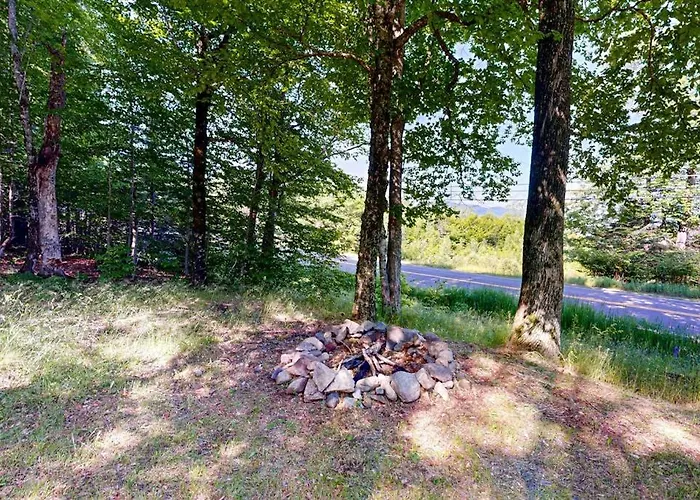 Scenic Retreat With A Spacious Deck, Gas Fireplace, And Moosehead Lake Views