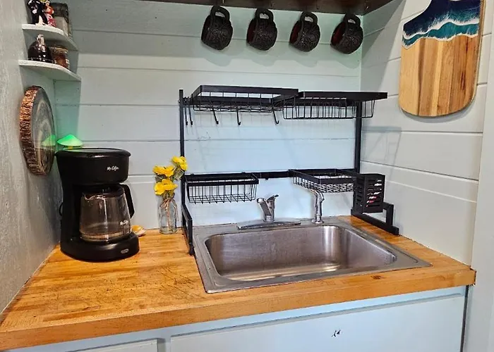 Pickles Place Is A Stacked Container Home In The Texas Hill Country This Space Is Surrounded By Giant Elm Trees Lush Greenery Across The Street From The San Gabriel River One Double Bed Full Size Shower & Full Kitchen Plus Bbq Pit & Flategrill
