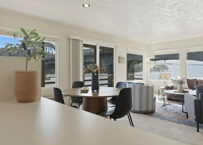 Incredible Riverfront Oasis With Wraparound Deck & Cozy Interior