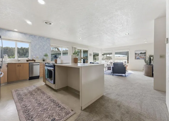 Incredible Riverfront Oasis With Wraparound Deck & Cozy Interior